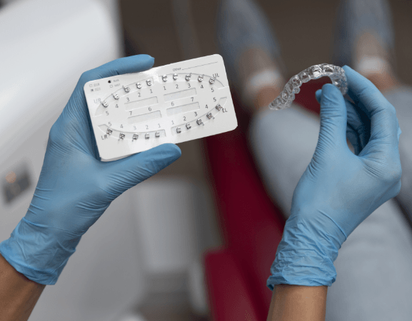 Clear Orthodontic Aligners And Dental Bracket System